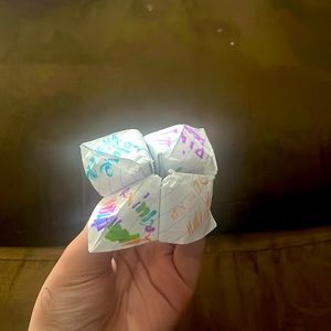 Medium fortuneteller has rainbow blue pink orange on it and has numbers inside